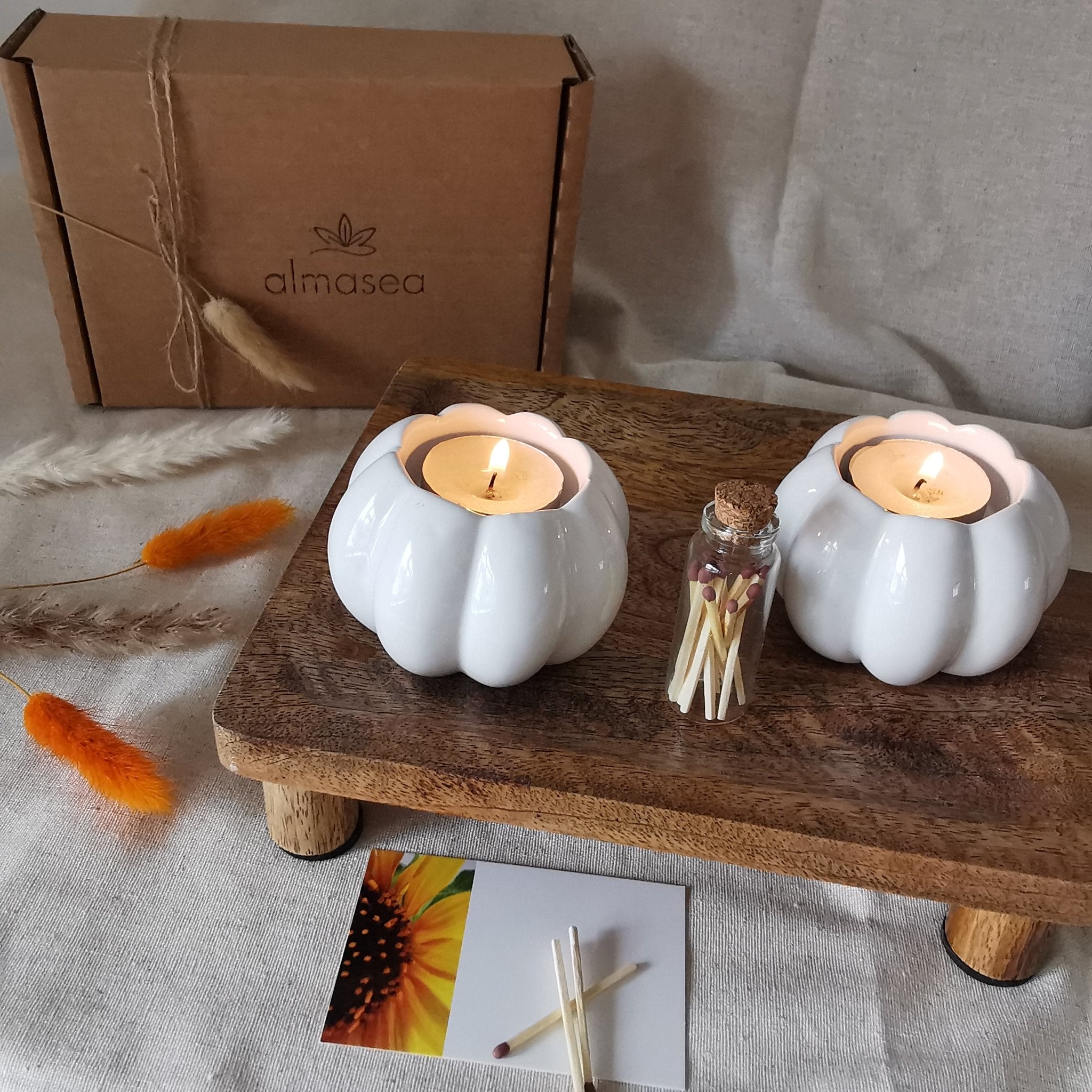 Set of two ceramic pumpkin tea light holders and matches