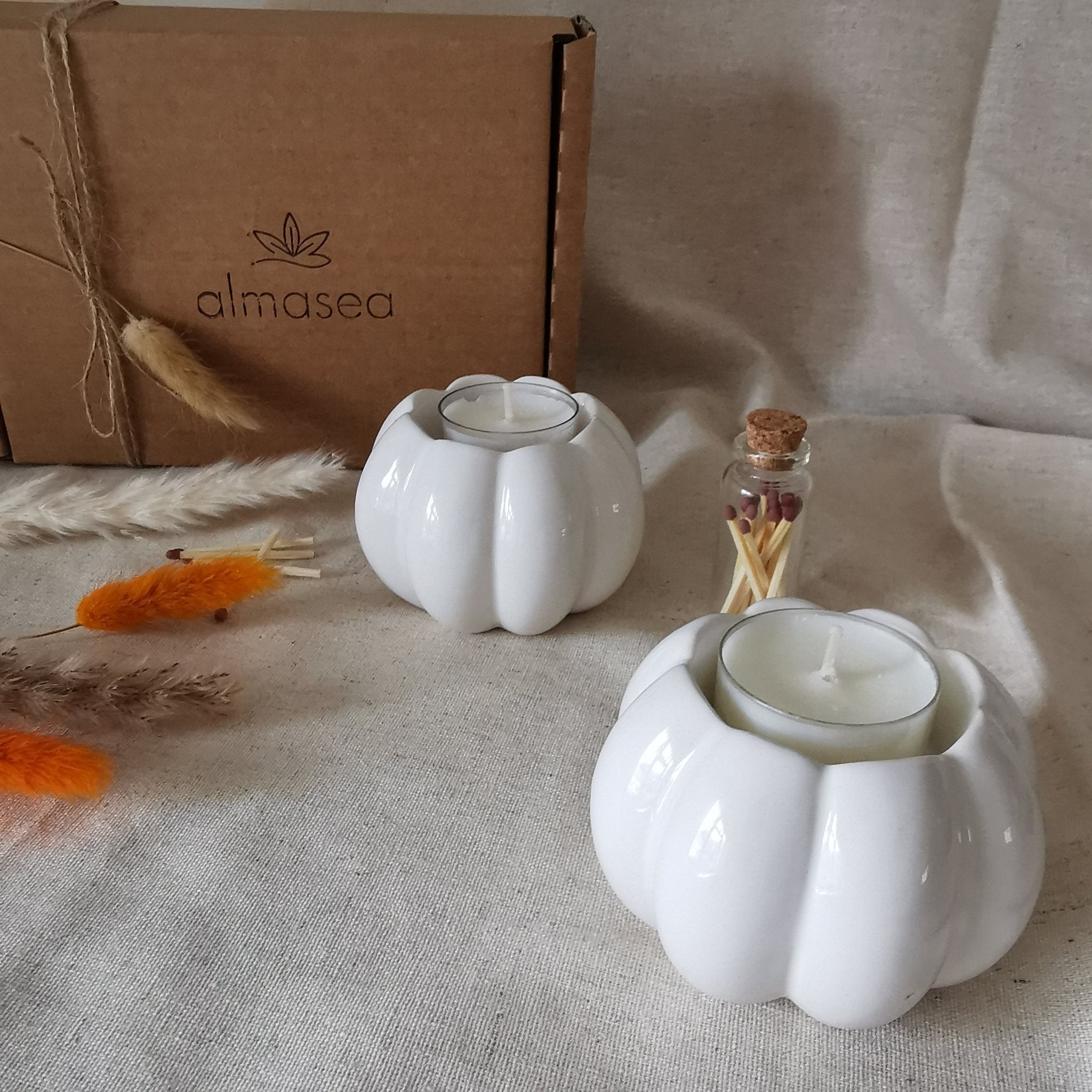 Set of two ceramic pumpkin tea light holders and matches